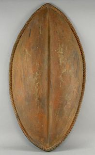 Movie Prop - A prop shield, with African inspired design coated fibreglass, from an unknown production, 33 x 18 inches