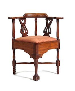 An American Walnut Corner Chair, Height 31 inches.