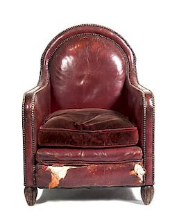 An American Studded Leather Armchair, Height 37 inches.