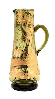 A Parcel Gilt and Etched Glass Pitcher, Height 14 inches.