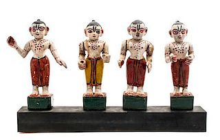 Four Carved Wood and Polychrome Figures, Height overall 12 x width 20 1/8 x depth 3 inches.