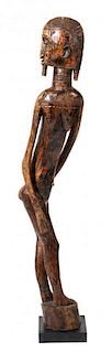 An African Carved Wood Dogon Style Statue, Height 59 1/2 inches.
