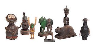 A Collection of Eight Carved Wood Figures, Height of tallest 11 1/4 inches.