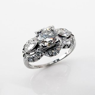Circa 1950s Approx. 1.56 Carat TW Diamond and Platinum Engagement Ring set in the Center with a .96 Carat Round Brilliant Cut