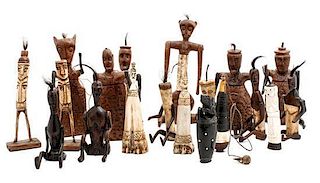 A Collection of Indonesian Carved Wood and Bone Bottles, Height of tallest 10 inches.