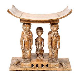 An African Carved Wood Asante Stool, Height 30 1/4 x width 30 x 19 1/4 inches.