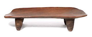 An African Carved Wood Senufo Bed, Height 14 3/4 x width 24 1/2 x depth 65 1/2 inches.