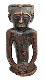 An African Carved Wood Baluba Neck Rest, Height 22 x width 9 1/2 x depth 7 inches.