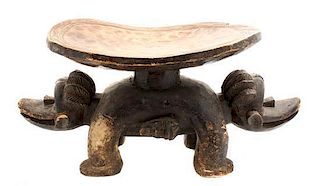 A African Carved Wood Stool, Height 12 1/2 x width 28 x depth 12 inches.
