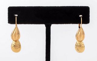 Pair of 14K yellow gold drop earrings with diamond-cut textured drop earring jackets, marked: "14KEG/JCM14K". Earrings measure 0.812"L x 0.312"W. Drop