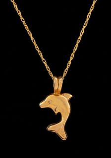 14K yellow gold mini-dolphin motif pendant necklace, marked: "14K / F". Pendant: 0.56"L x 0.31"W on 18.12"L x 0.04"W chain with spring clasp. Approx: 