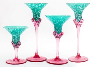 Set of four floriform candlesticks in green and pink Murano glass, apparently unsigned. 10" H x 4" diameter (the largest)