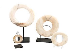 Four Abelam Clam Shell Currency Rings, Yua, Papua New Guinea Diameter of largest 10 3/4 inches.
