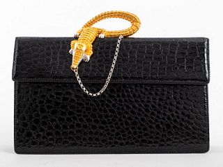 Lee Wolfe by Motti Lerer and Lee Kagan purse / handbag, with a silver- and gold-toned alligator decoration, faux crocodile exterior, and black interio