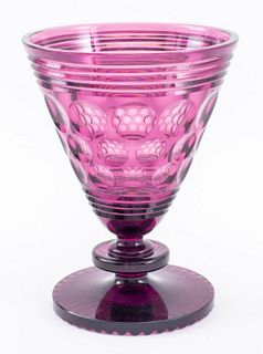 Modern hand-blown purple amethyst cut glass tazza or compote with circular faceted decoration to cup upon a ribbed round foot, apparently unsigned. 8.