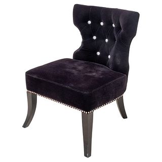 Modern Hollywood Regency style lounge chair upholstered in black velvet with rhinestone buttons, silver-tone metal grommets, and four ebonized cabriol