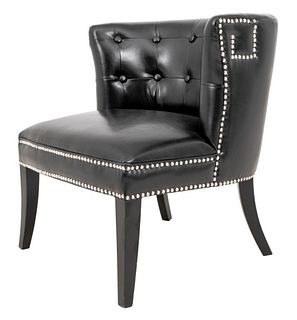 Modern black vegan leather upholstered with buttoned backrest and studded neoclassical motif to arms, raised on ebonized wood sabre legs. 28.5" H x 26