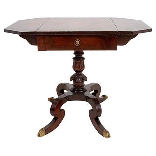 Regency Style mahogany drop-leaf sofa table having one drawer, raised on acanthus craved pedestal ending with four curved, tapering legs with brass ca