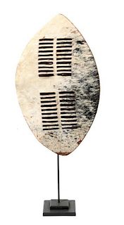 An African Zulu Style Animal Hide Shield, Height 26 x width 15 inches.