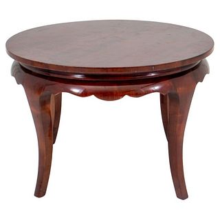Art Deco round mahogany low table with scrolling skirt, in the taste of James Mont. 18.5" H x 27.75" diameter.