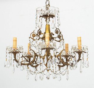 French Louis XV style chased gilt metal 5-light chandelier with various crystal pendants and drops throughout. 19" H x 19" Diameter.