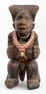 African carved wood sculpture of a seated chief or Mwanangana, playing the Sanza (thumb piano) in headdress, possibly Chokwe people, Angola or Democra