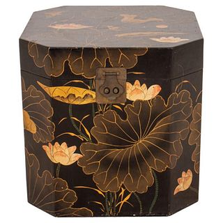 Large Japanese faux lacquer decorated storage box in the form of a chamfered cube with hinged lid, the black lacquered sides decorated with lotus leav