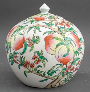 Chinese porcelain ginger vase with lid, having peach motifs in the famille rose palette, signed to underside. 8" H x 8" diameter.