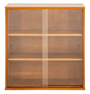 Mid-Century Scandinavian style walnut bookcase with glass sliding doors, having two wood shelves to inside, apparently unsigned, circa 1960s. 36" H x 