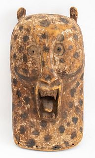 African Songye large leopard mask, possibly Congolese, the leopard with painted camouflage decoration, possibly 20th century. 22" H x 11" W x 7.5" D