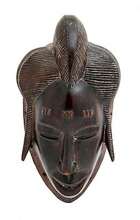 An African Carved Wood Yaure Mask, Length 10 1/4 inches.