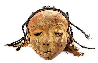 An African Carved Wood Pende Mask, Height 8 1/2 inches.