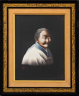 Chinese silk embroidery portrait of a smiling woman, housed under glass in an ebonized and gilt wood frame. Image: 10.25" H x 8" W; frame: 14.75" H x 