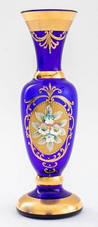 Bohemian gilt and enameled cobalt glass vase, of baluster form and centering a cartouche of forget-me-nots in sculptural enamel and with gilt-encruste