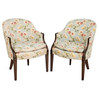 American Sheraton style pair of arm chairs with spoon back raised on tapered legs with floral upholstery. 36" H x 26.5" W x 27" D; seated: 21".
