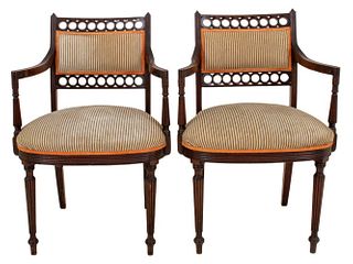 Pair of American Sheraton Style carved mahogany armchairs with upholstered seat, raised on turned tapered legs. 34" H x 22" W x 22" D; seated: 18.5".
