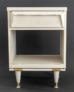 Mid-Century Modern white painted wood nightstand with gilt metal accent details raised on tapered feet, having one drawer above one open shelf. 27" H 