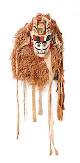 An African Carved Wood and Polychrome Decorated Yoruba Gelede Masquerade Mask, Length 56 inches.