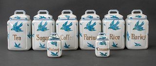 Eight vintage Rudolstadt porcelain kitchen canisters / lidded jars, decorated with the motif of blue birds and each marked with a pantry staple includ
