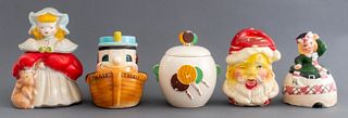 Assembled group of five different American ceramic cookie jars with covers. Largest: 12" H x 8" W x 8" D.
