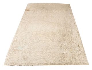 Cream-colored wool rug, unmarked. 10' H x 8'1" W