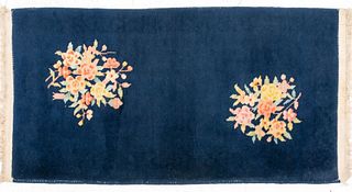 Small Chinese Art Deco style carpet with floral design on a blue ground. 4' 2" H x 2' 1" W.