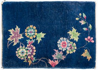 Small Chinese Art Deco carpet with polychrome floral design on a blue ground. 2' 10" H x 2" W.