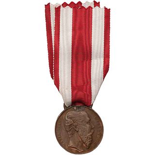 Navalón, Sebastián. Medalla al Mérito Militar. En bronce, 32 mm. Anverso: Efigie de Maximiliano de perfil a la d...