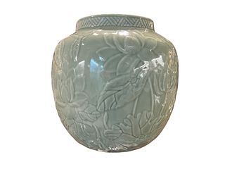 A Celadon-Glazed Carved Ovoid Jar