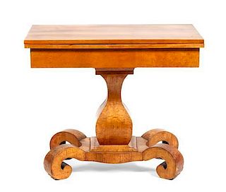 A Biedermeier Birdseye Maple Flip-top Table, Height 32 x width 20 closed x depth 36 inches
