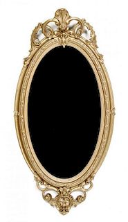 A Gilt Composition Mirror, Height 53 3/4 x width 27 inches.