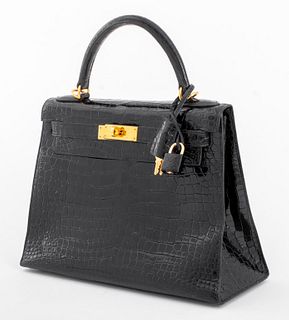 Hermes black alligator Kelly bag in pristine condition, designed by Jean-Louis Robert Frederic Dumas (French, 1938-2010), with original mini padlock a