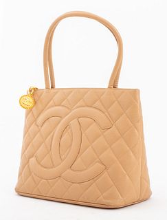 Chanel "Medallion" tote in caviar quilted tan lambskin leather, the purse with two top handles embroidered with signature double C logo to front,