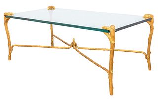 P. E. Guerin, New York cocktail low table with brass faux-bois legs joined by stretchers and bundled finial supporting a glass top, stamped "P. E. Gue